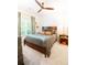 Cozy bedroom with wood frame bed, ceiling fan, and a window with natural light at 796 Piedmont Ne Way, Atlanta, GA 30324