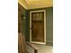 Close up of the stained wood front door with glass inset and matte black hardware at 796 Piedmont Ne Way, Atlanta, GA 30324