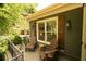 Charming front porch with wooden Adirondack chairs, green siding and wooden shutters at 796 Piedmont Ne Way, Atlanta, GA 30324