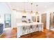 Bright kitchen with white cabinets, stainless steel appliances, a marble island and hardwood floors at 796 Piedmont Ne Way, Atlanta, GA 30324