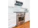 Close up of the kitchen stainless steel oven, range and white marble countertops at 796 Piedmont Ne Way, Atlanta, GA 30324