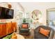 Cozy living room with brick accent wall, stylish seating, and access to an outdoor area at 796 Piedmont Ne Way, Atlanta, GA 30324