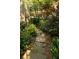 Charming stone pathway surrounded by lush greenery leading through the garden at 796 Piedmont Ne Way, Atlanta, GA 30324