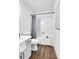 Clean and modern bathroom featuring white cabinets, and a bathtub with shower at 90 Lake Avalon Ct, Dallas, GA 30157