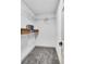 Walk-in closet with ample shelf storage for organizing clothes and personal belongings at 90 Lake Avalon Ct, Dallas, GA 30157