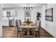 Charming dining area featuring a table set for four, adjacent to the kitchen at 90 Lake Avalon Ct, Dallas, GA 30157