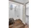 Functional laundry room with shelving, vinyl floors and stylish decor at 90 Lake Avalon Ct, Dallas, GA 30157