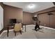 Spacious basement area with a desk and exercise equipment, providing a versatile living space at 1105 Sterling Brooke Dr, Alpharetta, GA 30022