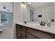 Bathroom with double sinks, vanity, mirror and a view to the bedroom at 1105 Sterling Brooke Dr, Alpharetta, GA 30022