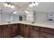 Bathroom vanity features double sinks, dark wood cabinets, and plenty of counter space at 1105 Sterling Brooke Dr, Alpharetta, GA 30022