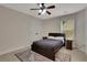Bedroom with a large bed, ceiling fan, and traditional decor, creating a relaxing atmosphere at 1105 Sterling Brooke Dr, Alpharetta, GA 30022