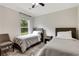 Cozy bedroom featuring twin beds, a neutral color palette, and a large window for natural light at 1105 Sterling Brooke Dr, Alpharetta, GA 30022