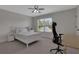 Bedroom with view from window, includes a desk, a bed, and white furniture at 1105 Sterling Brooke Dr, Alpharetta, GA 30022