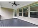 Covered deck area features a ceiling fan and offers ample space for outdoor enjoyment at 1105 Sterling Brooke Dr, Alpharetta, GA 30022