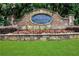 Elegant stone entrance sign with manicured flower beds adding charm to the Sterling Brooke community at 1105 Sterling Brooke Dr, Alpharetta, GA 30022