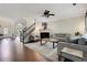 Bright living room features a fireplace, staircase and views of the outdoors at 1105 Sterling Brooke Dr, Alpharetta, GA 30022