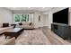 Bright living room featuring modern furnishings, hardwood floors, and large windows with natural light at 1105 Sterling Brooke Dr, Alpharetta, GA 30022