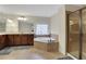 Luxurious main bathroom features a corner soaking tub, walk-in shower, and stylish vanity at 1105 Sterling Brooke Dr, Alpharetta, GA 30022