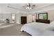 Bright main bedroom featuring neutral walls, carpet flooring, and ensuite bathroom access at 1105 Sterling Brooke Dr, Alpharetta, GA 30022