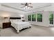 Spacious main bedroom features large windows, a ceiling fan, and a private deck entrance at 1105 Sterling Brooke Dr, Alpharetta, GA 30022