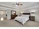 Cozy main bedroom with a wooden bed frame, dresser with mirror, and neutral walls at 1105 Sterling Brooke Dr, Alpharetta, GA 30022