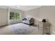 Cozy sitting room features a comfortable couch, neutral walls, and natural lighting at 1105 Sterling Brooke Dr, Alpharetta, GA 30022