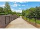 Scenic community path with safety railings, inviting residents to enjoy a peaceful stroll outdoors at 1105 Sterling Brooke Dr, Alpharetta, GA 30022