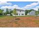 Large backyard featuring a new two-story home with a manicured lawn and picturesque surroundings at 4563 Sweetlake Court Sw, Mableton, GA 30127