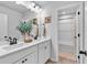 Bright bathroom with double sinks, modern fixtures, and a separate shower/tub area at 4563 Sweetlake Court Sw, Mableton, GA 30127