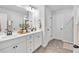 Well-lit bathroom with double sink vanity, modern fixtures, and ample counter space at 4563 Sweetlake Court Sw, Mableton, GA 30127