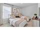 Inviting bedroom featuring twin beds, soft lighting, and a window with natural sunlight at 4563 Sweetlake Court Sw, Mableton, GA 30127