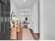 Inviting foyer with hardwood floors, a stylish console table, and a decorative mirror at 4563 Sweetlake Court Sw, Mableton, GA 30127