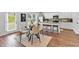 Bright kitchen with white cabinetry, granite countertops, stainless steel appliances, and dining area for a cozy atmosphere at 4563 Sweetlake Court Sw, Mableton, GA 30127
