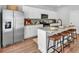 Well-equipped kitchen with stainless steel appliances, granite countertops, ample storage, and a breakfast bar for casual dining at 4563 Sweetlake Court Sw, Mableton, GA 30127