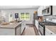 Chef's kitchen featuring modern stainless steel appliances, granite countertops, ample counter space, and stylish design at 4563 Sweetlake Court Sw, Mableton, GA 30127