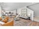 Open-concept living room with hardwood floors, a modern fireplace, and stylish furnishings at 4563 Sweetlake Court Sw, Mableton, GA 30127