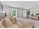 Bright primary bedroom featuring large windows, cozy bedding, and a light and airy atmosphere at 4563 Sweetlake Court Sw, Mableton, GA 30127