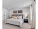 Serene primary bedroom with soft lighting, patterned linens, and neutral decor creating a cozy retreat at 4563 Sweetlake Court Sw, Mableton, GA 30127