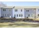 Townhome exterior boasts a modern facade, well-maintained landscaping, and a private backyard at 907 Agate Ln, Lawrenceville, GA 30043