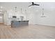 Modern kitchen with a center island, stainless steel appliances, and an open layout for seamless entertaining at 907 Agate Ln, Lawrenceville, GA 30043