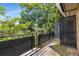 Private outdoor balcony with wooded views at 115 Biscayne Nw Dr # E3, Atlanta, GA 30309