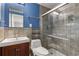 Bathroom with tiled shower, modern fixtures, and cherry vanity at 115 Biscayne Nw Dr # E3, Atlanta, GA 30309