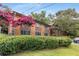 A lush green lawn and landscaping surround this brick exterior condo building at 115 Biscayne Nw Dr # E3, Atlanta, GA 30309