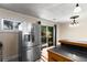 Kitchen area featuring stainless steel refrigerator and sliding glass door leading to backyard at 115 Biscayne Nw Dr # E3, Atlanta, GA 30309