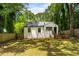 Backyard featuring a well-maintained lawn, trees, and wood fence at 345 Adelle Se St, Atlanta, GA 30315