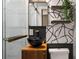 Bathroom showcasing dark vanity with a black bowl sink and a modern black and white accent wall at 345 Adelle Se St, Atlanta, GA 30315
