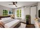 Bedroom with hardwood floors, natural light, ceiling fan and a modern sliding barn door for closet at 345 Adelle Se St, Atlanta, GA 30315