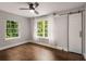 Spacious bedroom offers ample natural light, sleek ceiling fan, and a modern barn door for closet access at 345 Adelle Se St, Atlanta, GA 30315