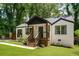 Quaint home showing its front porch and newly landscaped yard offering curb appeal at 345 Adelle Se St, Atlanta, GA 30315