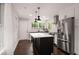 Modern kitchen with stainless steel appliances, a center island, and white subway tile backsplash at 345 Adelle Se St, Atlanta, GA 30315
